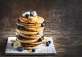 Pancakes with banana, blueberry and maple syrup for a breakfast Royalty Free Stock Photo