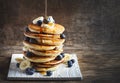 Pancakes with banana, blueberry and maple syrup for a breakfast Royalty Free Stock Photo