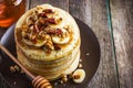 Pancakes with banana, nuts and honey