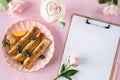 Pancakes with berries and honey on a pink pastel background, top view, copy space. Royalty Free Stock Photo