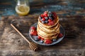 Pancakes with berries and maple syrup. Sweet homemade stack of pancakes