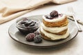 Pancakes with berry and jam. homemade, vegan pancakes with cream and fruit jam