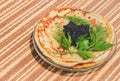 Pancakes with black caviar