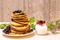Pancakes with black currant berries and yoghurt