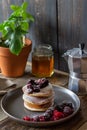 Pancakes with blackberries, raspberries and red currants. American cuisine