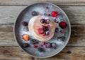 Pancakes with blackberries, raspberries and red currants. American cuisine