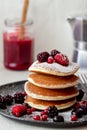 Pancakes with blackberries, raspberries and red currants. American cuisine