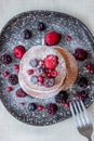 Pancakes with blackberries, raspberries and red currants. American cuisine Royalty Free Stock Photo