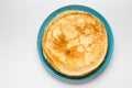 Pancakes on a blue plate white background