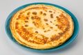 Pancakes on a blue plate white background