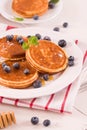 Pancakes with blueberries and chocolate cream. Royalty Free Stock Photo