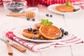 Pancakes with blueberries and chocolate cream. Royalty Free Stock Photo