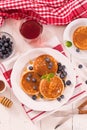 Pancakes with blueberries and chocolate cream. Royalty Free Stock Photo