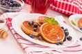 Pancakes with blueberries and chocolate cream. Royalty Free Stock Photo