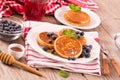 Pancakes with blueberries and chocolate cream. Royalty Free Stock Photo