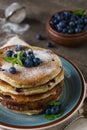 Pancakes with blueberries, mint and powdered sugar Royalty Free Stock Photo