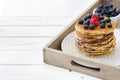 Pancakes with blueberries and raspberry on tray Royalty Free Stock Photo