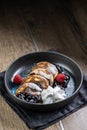 Pancakes with blueberry jam and raspberries in a bowl