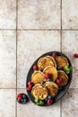 Pancakes in brown ceramic plate with blueberry, raspberry and mint leaves, top view Royalty Free Stock Photo