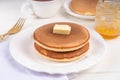 Pancakes with butter and honey or maple syrup drizzles Royalty Free Stock Photo