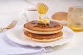 Pancakes with butter and honey or maple syrup drizzles Royalty Free Stock Photo