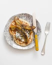 Pancakes with caramelized bananas on a white background, top view Royalty Free Stock Photo