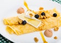 Pancakes with cheese Brie, blueberry and fuagra