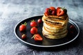 Pancakes with chocolate nutella filling decorated with strawberries Royalty Free Stock Photo