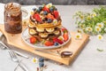 Pancakes with chocolate paste and hazelnuts, banana, strawberry and blueberry Royalty Free Stock Photo