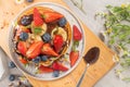 Pancakes with chocolate paste and hazelnuts, banana, strawberry and blueberry Royalty Free Stock Photo