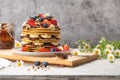 Pancakes with chocolate paste and hazelnuts, banana, strawberry and blueberry Royalty Free Stock Photo