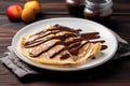 pancakes with chocolate spread and strawberries Royalty Free Stock Photo