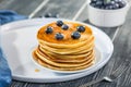 Pancakes close up, with fresh blueberries and maple syrup. Royalty Free Stock Photo