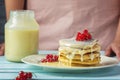 Pancakes with condensed milk. Tasty breakfast with red currant berries