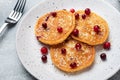 Pancakes with cottage cheese and cranberries. Homemade fried cheesecakes.