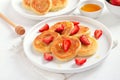 Pancakes with cottage cheese and strawberry slices