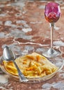 Pancakes with Crepe Suzette, in transparent plate with glass of liqueur. French cuisine, step by step recipe Royalty Free Stock Photo