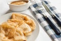 Pancakes crepes with caramel sauce lay on a plate Royalty Free Stock Photo