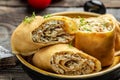 Pancakes or crepes roll with the chicken meat served on a white plate, Food recipe background. Close up Royalty Free Stock Photo