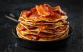 Pancakes with crispy bacon and maple syrup in cast iron skillet, frying pan. Morning Breakfast Royalty Free Stock Photo