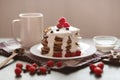 Pancakes on dark wooden table decorated with berries, spoon, cup with coffee or tea, raspberry and blueberry, tasty breakfast for Royalty Free Stock Photo