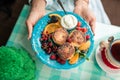 Pancakes decorated with fruits on glass table for breakfast Royalty Free Stock Photo