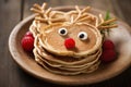 Pancakes decorated to look as a reindeer. Christmas dessert for children. Generative Ai Royalty Free Stock Photo