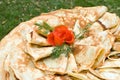 Pancakes decorated with tomato rose