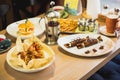 Pancakes desserts and tea on table. Table with tasty food Royalty Free Stock Photo