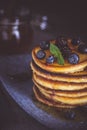 Pancakes with Fresh Berries and Maple Syrup on Dark Background Royalty Free Stock Photo