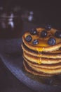 Pancakes with Fresh Berries and Maple Syrup on Dark Background Royalty Free Stock Photo