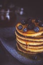 Pancakes with Fresh Berries and Maple Syrup on Dark Background Royalty Free Stock Photo