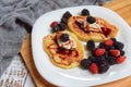 Pancakes with fresh blackberries and raspeberries, top view, horizontal