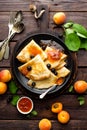 Pancakes with fresh blackcurrant and apricot jam Royalty Free Stock Photo